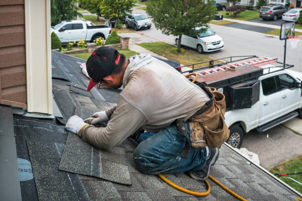 Professional Roofing technician working in Brookston, IN
